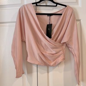 Crossover fitted blouse in pink silk &  poly blend.
